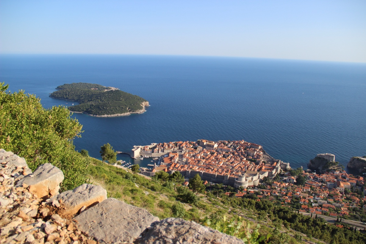Panorama of the Old Town and Lokrum island from the Srđ ridge, karst rock in the foreground