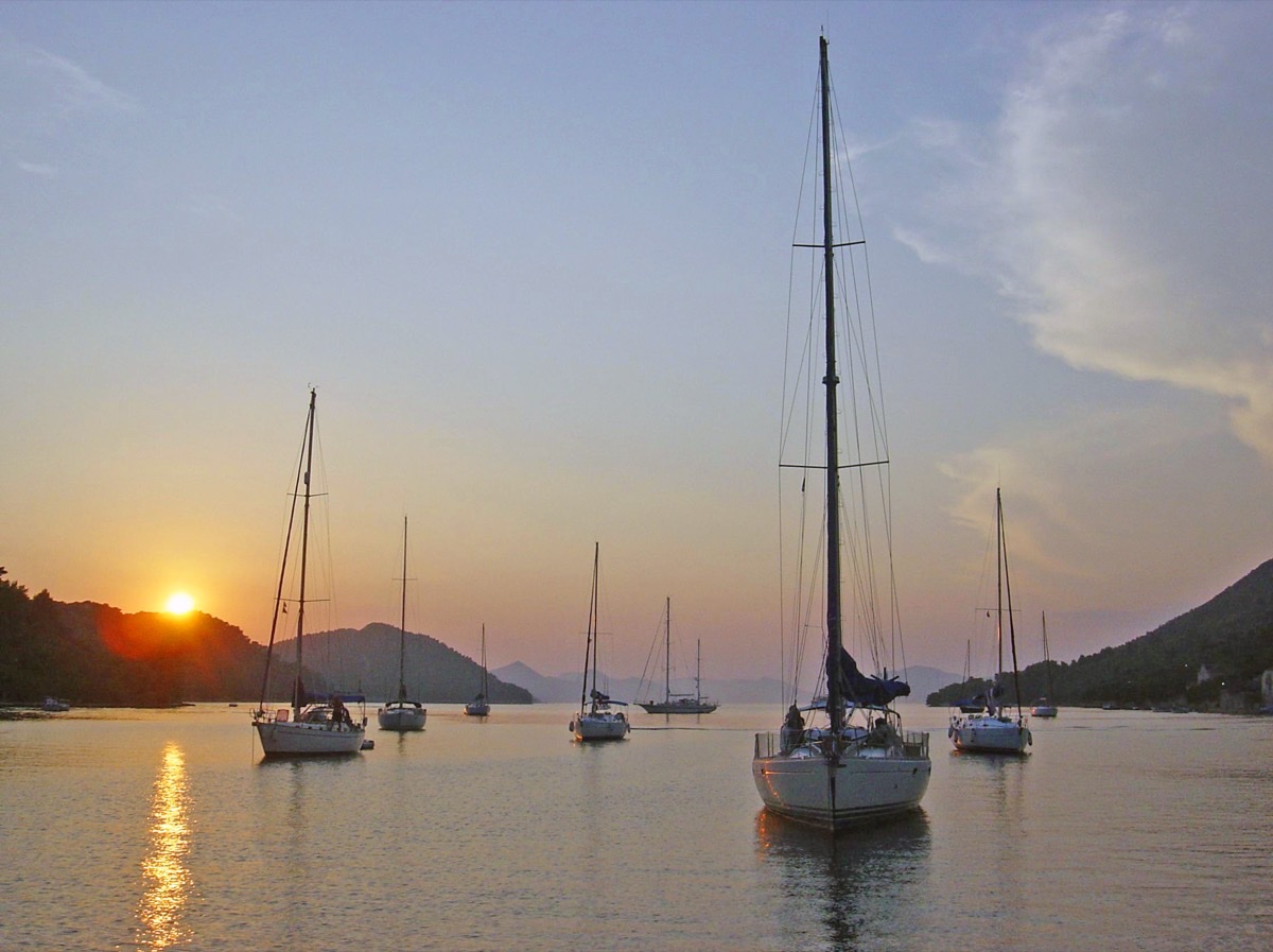 Sailboats at sunset in Šipanska Luka bay on the Elaphiti islands